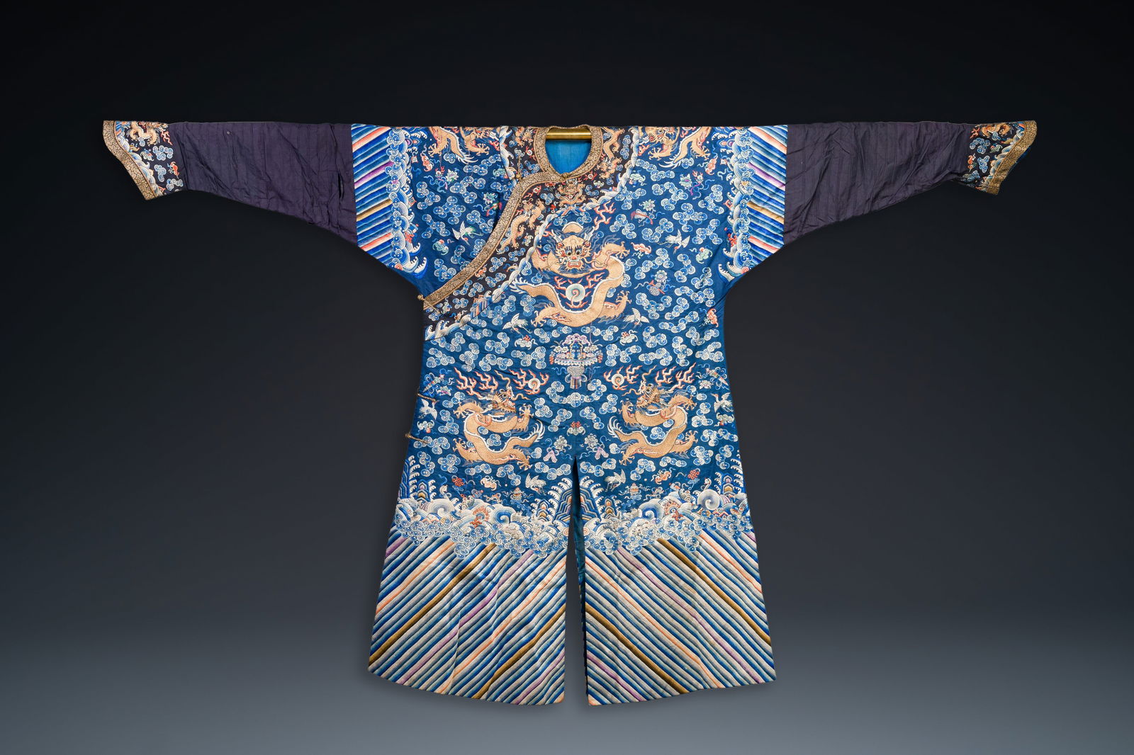 A Chinese gold thread embroidered blue-ground silk 'dragon' robe, 19th C. (1 of 7)