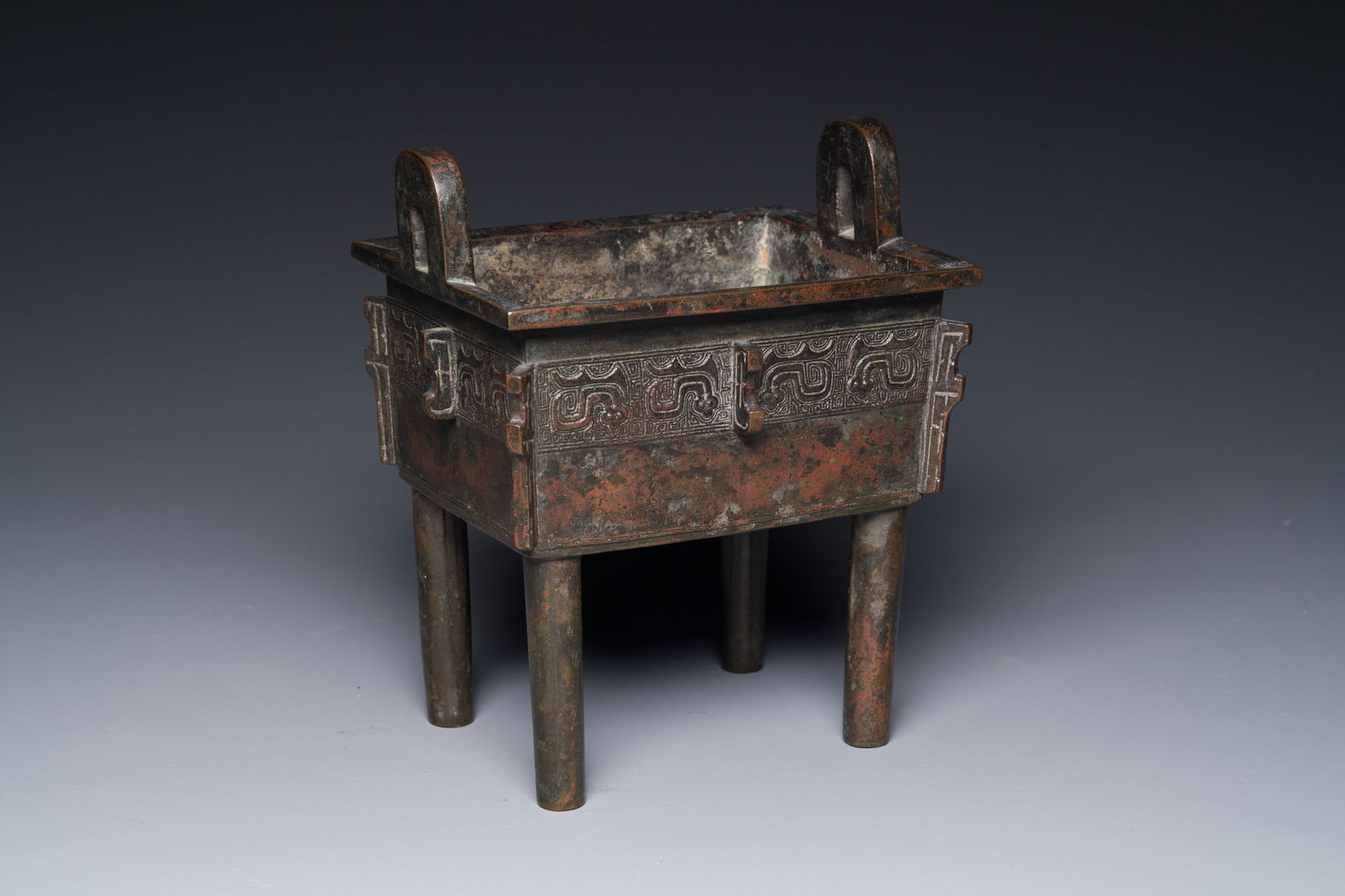 A Chinese Western Zhou-style rectangular bronze 'fangding' censer, Ming (1 of 8)