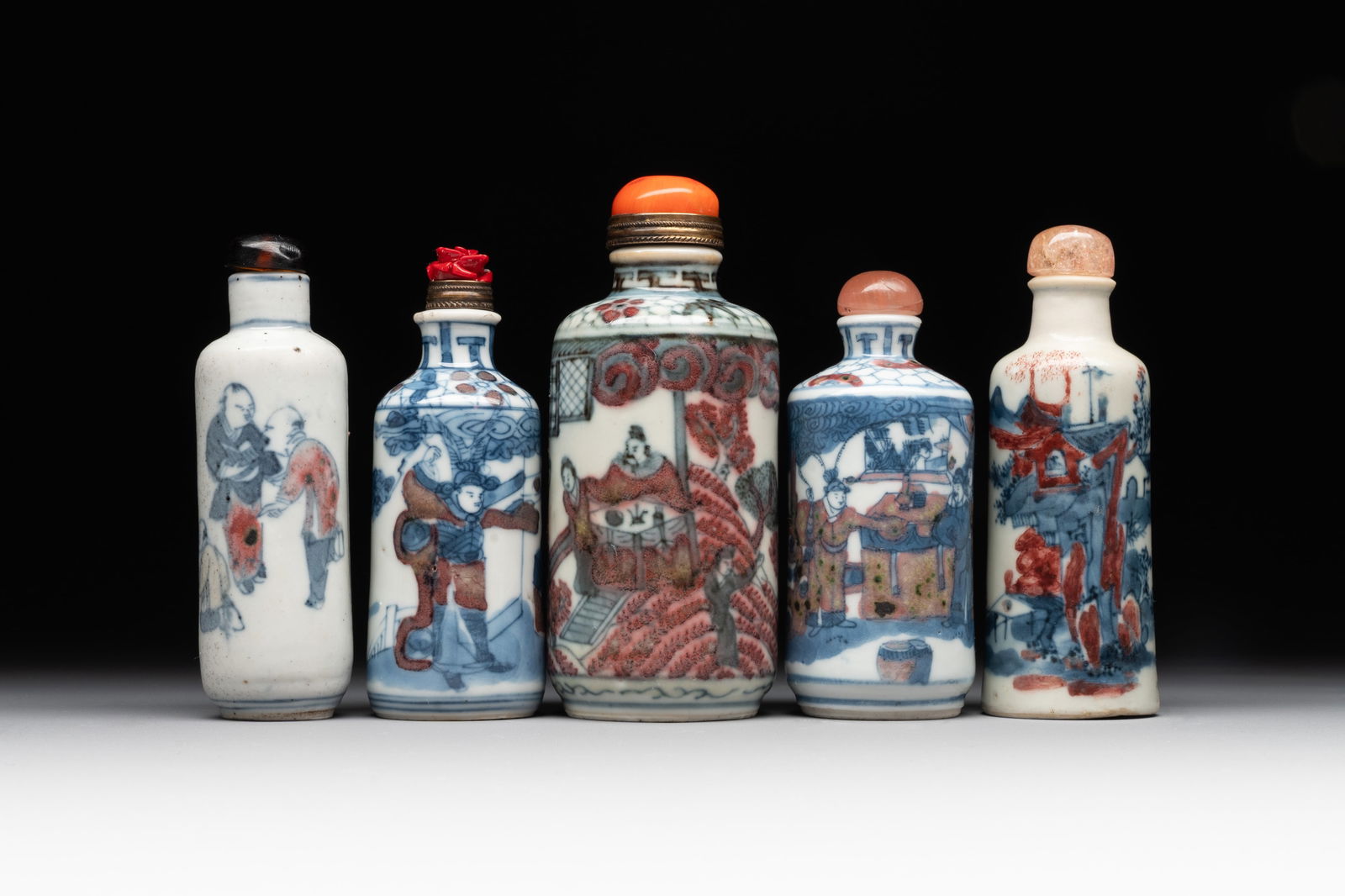 Five Chinese blue, white and copper-red snuff bottles, 19/20th C. (1 of 6)
