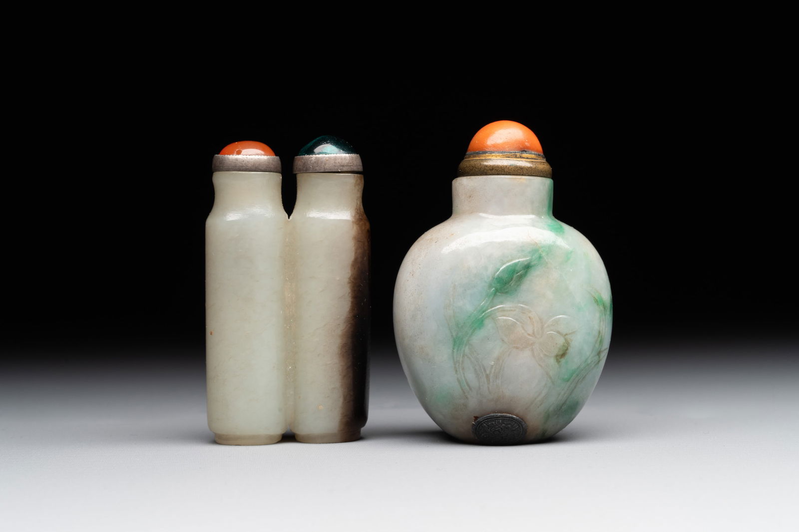 A Chinese jade conjoined double-snuff bottle and a jade 'lily' snuff bottle, 19th C. (1 of 6)