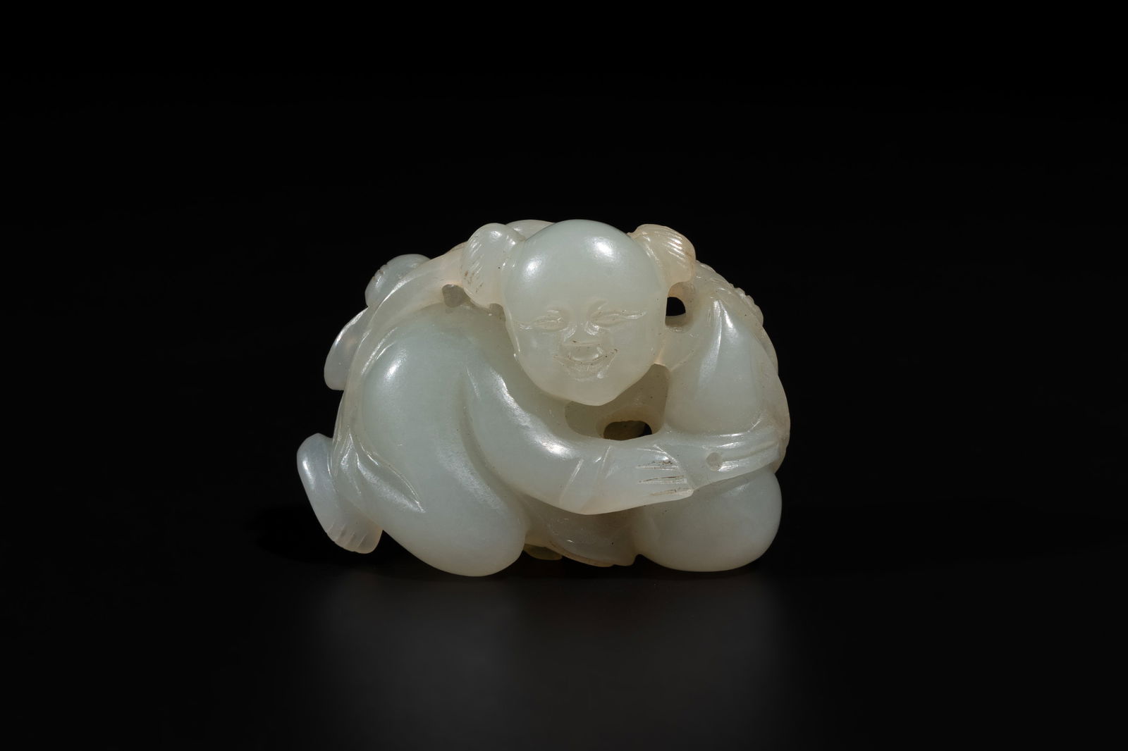 A Chinese white jade sculpture of a boy and a double gourd, Qing (1 of 6)