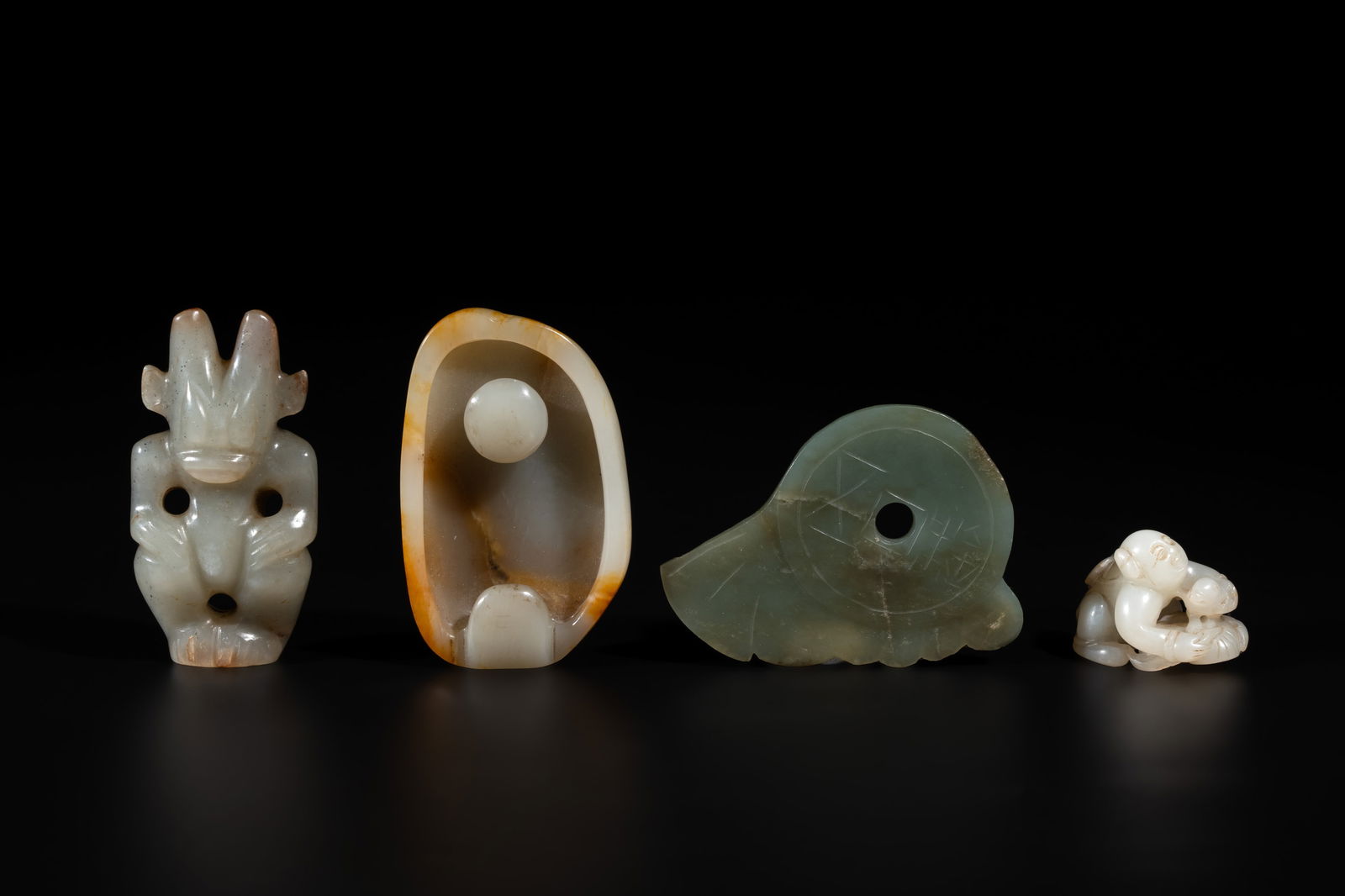 Three Chinese jades and an agate belt hook, Shang and later (1 of 6)