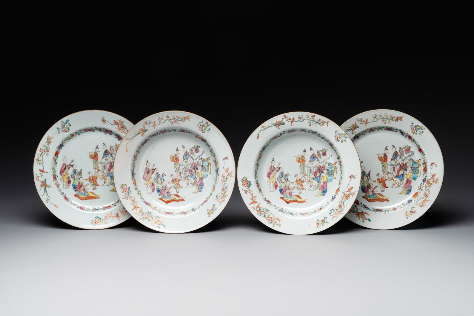 Four Chinese famille rose 'ladies playing music with children' plates, Qianlong (1 of 5)