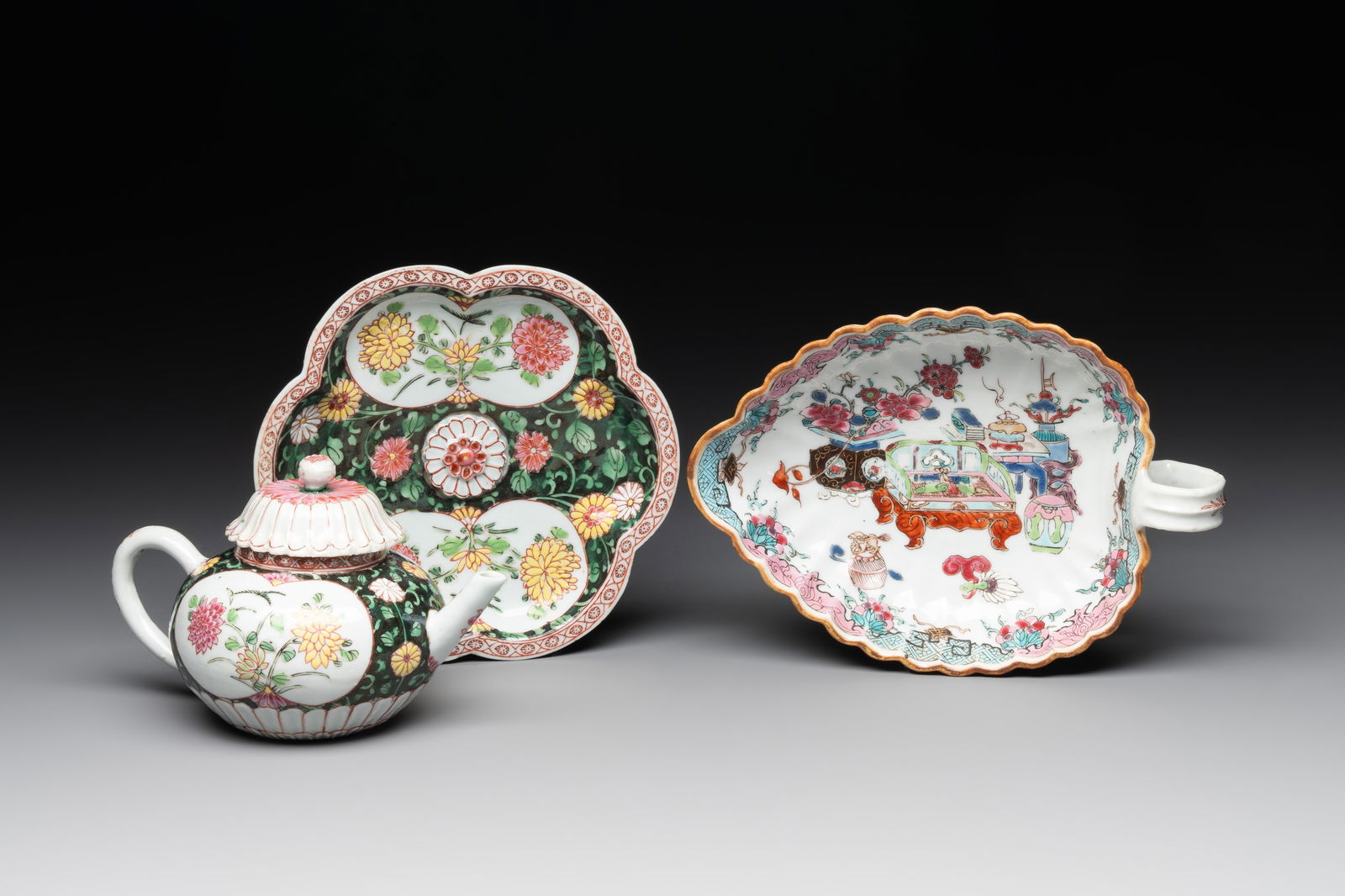 A Chinese famille rose black-ground teapot with cover and stand and a sauceboat, Qianlong (1 of 9)