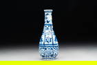 A Chinese blue and white facetted bottle vase with floral design, Kangxi