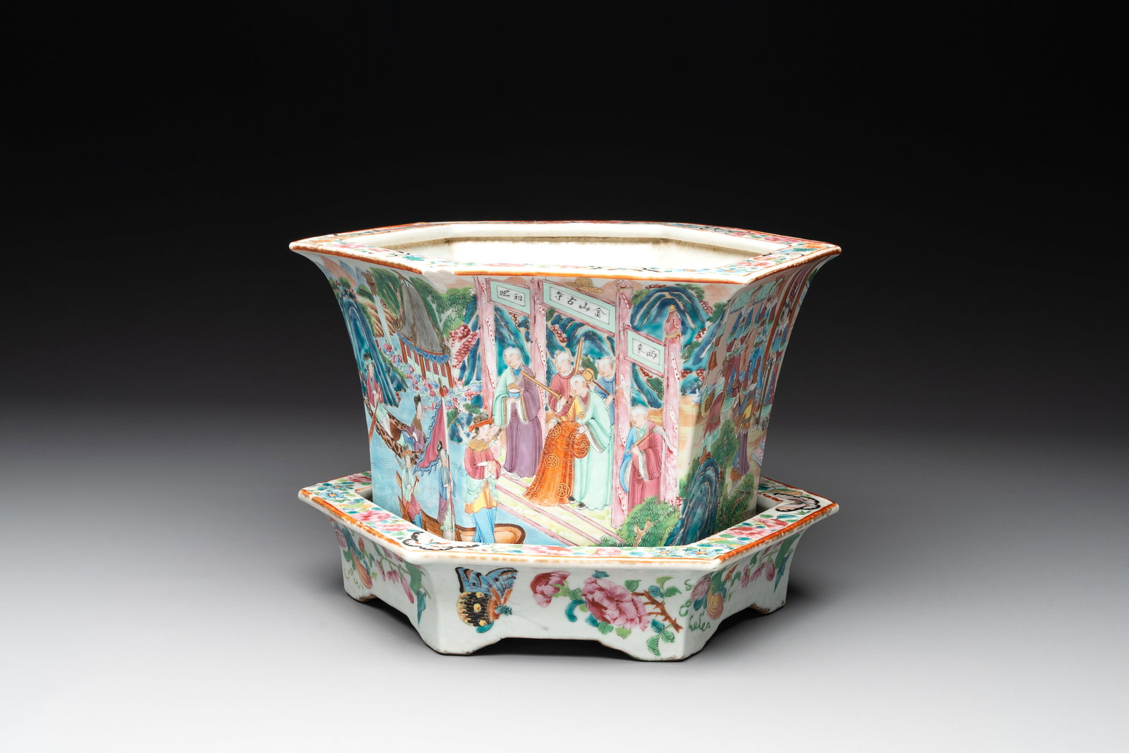 A Chinese Canton famille rose hexagonal jardiniere and stand with narrative design, 19th C. (1 of 6)