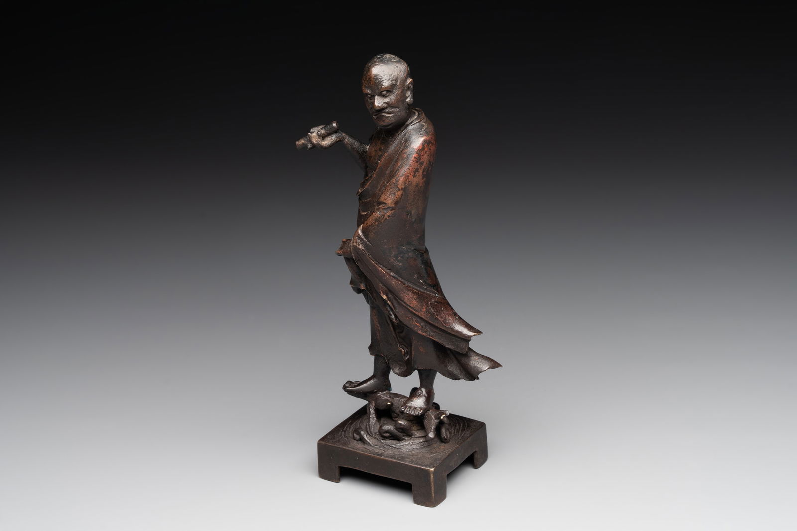 A fine Chinese bronze Luohan holding a sutra, Ming (1 of 7)