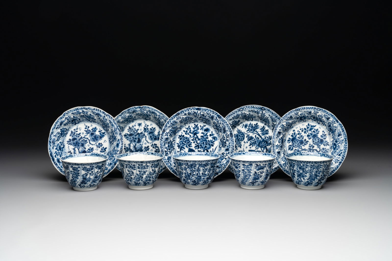 Five Chinese blue and white cups and saucers with floral design, Yu  mark, Kangxi (1 of 12)