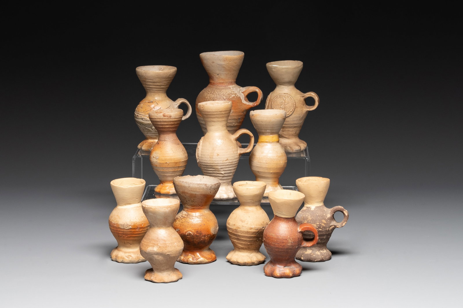 Twelve Siegburg stoneware funnel beakers, 15/16th C.: Twelve Siegburg stoneware funnel beakers, 15/16th C. H.: 16 cm (the tallest) H.: 11 cm (the smallest)