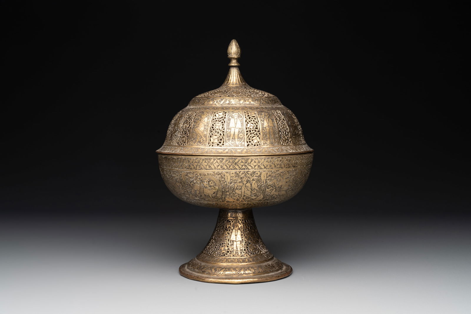 A Persian openworked brass incense burner, Qajar, 19th C. (1 of 6)