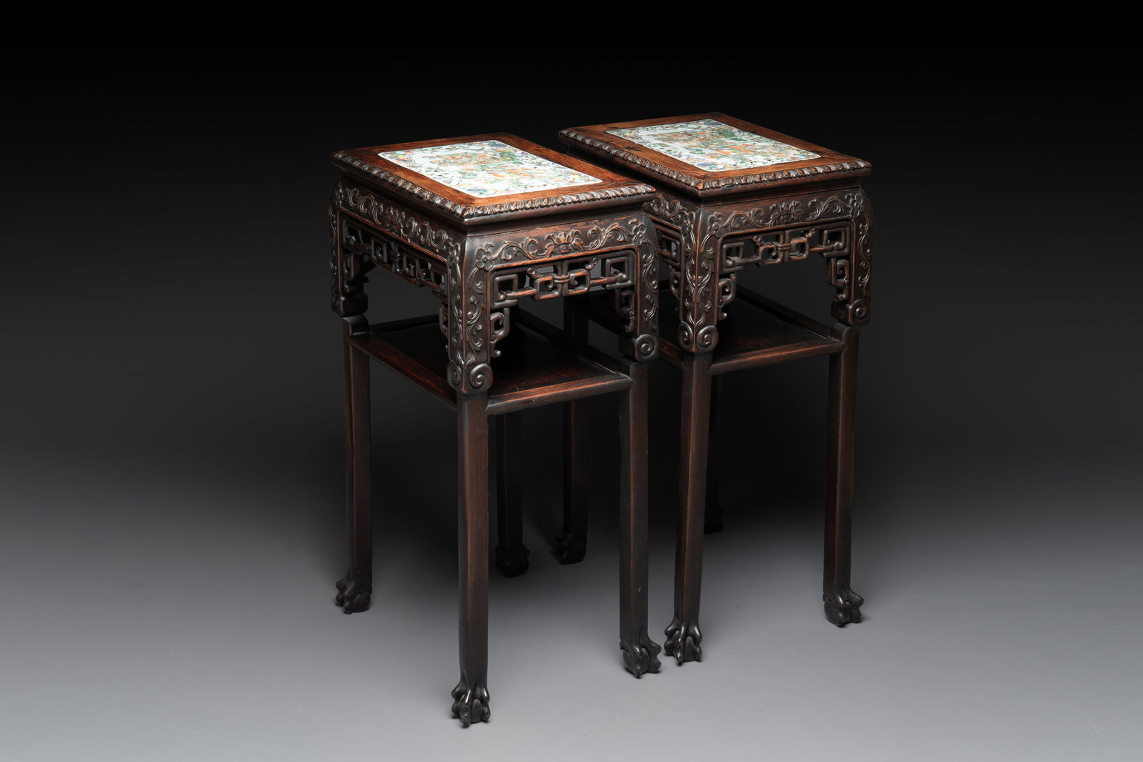 A pair of Chinese famille verte 'narrative' plaques mounted in hardwood tables, 19th C. (1 of 7)