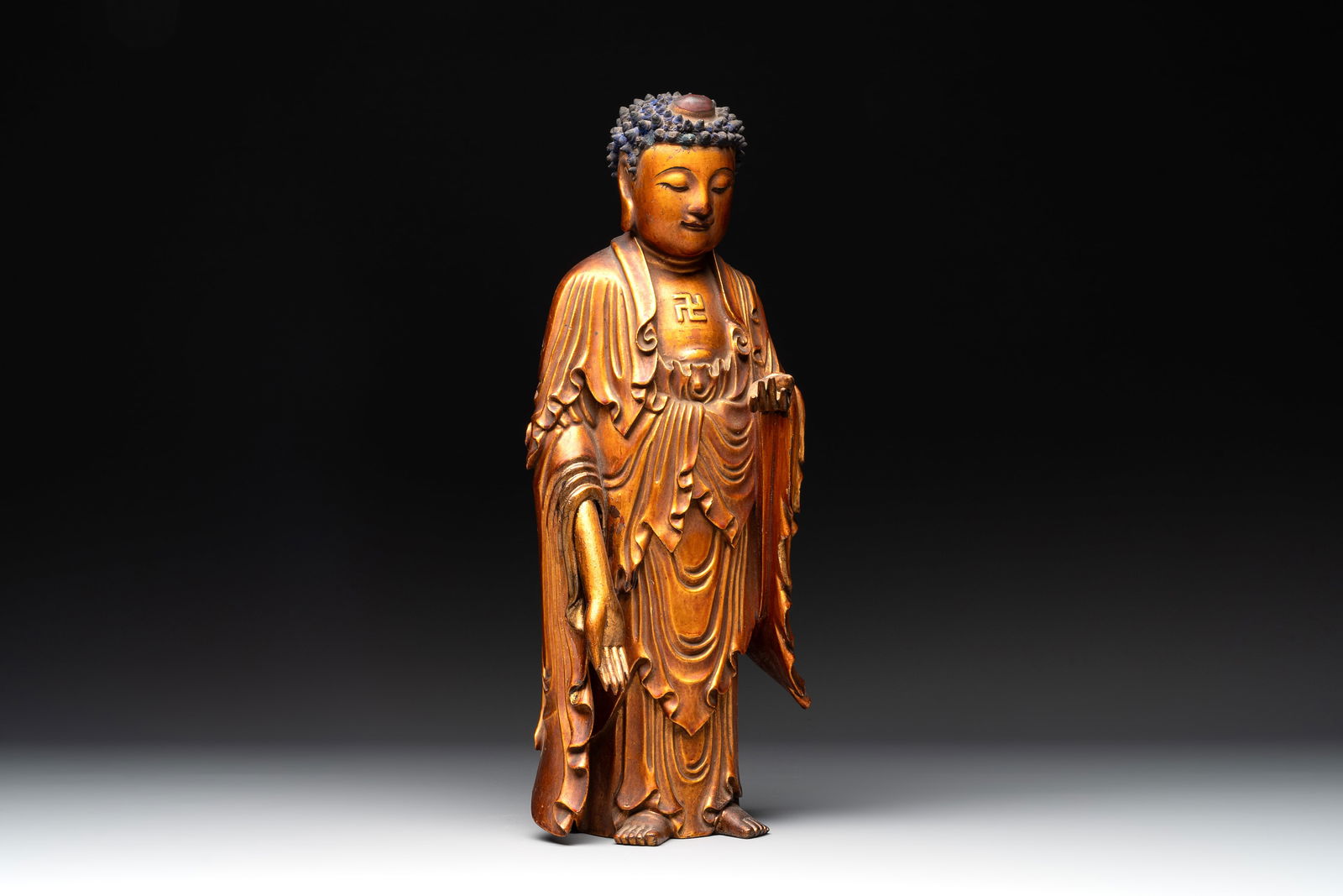 A fine Chinese gilt-lacquered wooden figure of the standing Buddha, Ming (1 of 7)