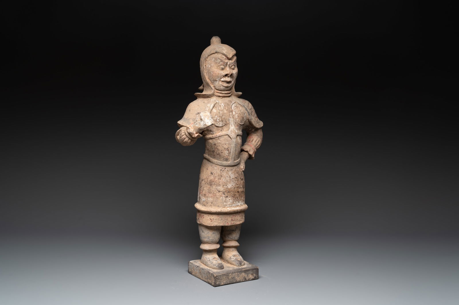A large Chinese painted pottery figure of a standing guardian, Tang: A large Chinese painted pottery figure of a standing guardian, Tang H.: 61,5 cm Provenance: A French private collection. With an Oxford Authentication test confirming the age, dated 12 January 2006, d