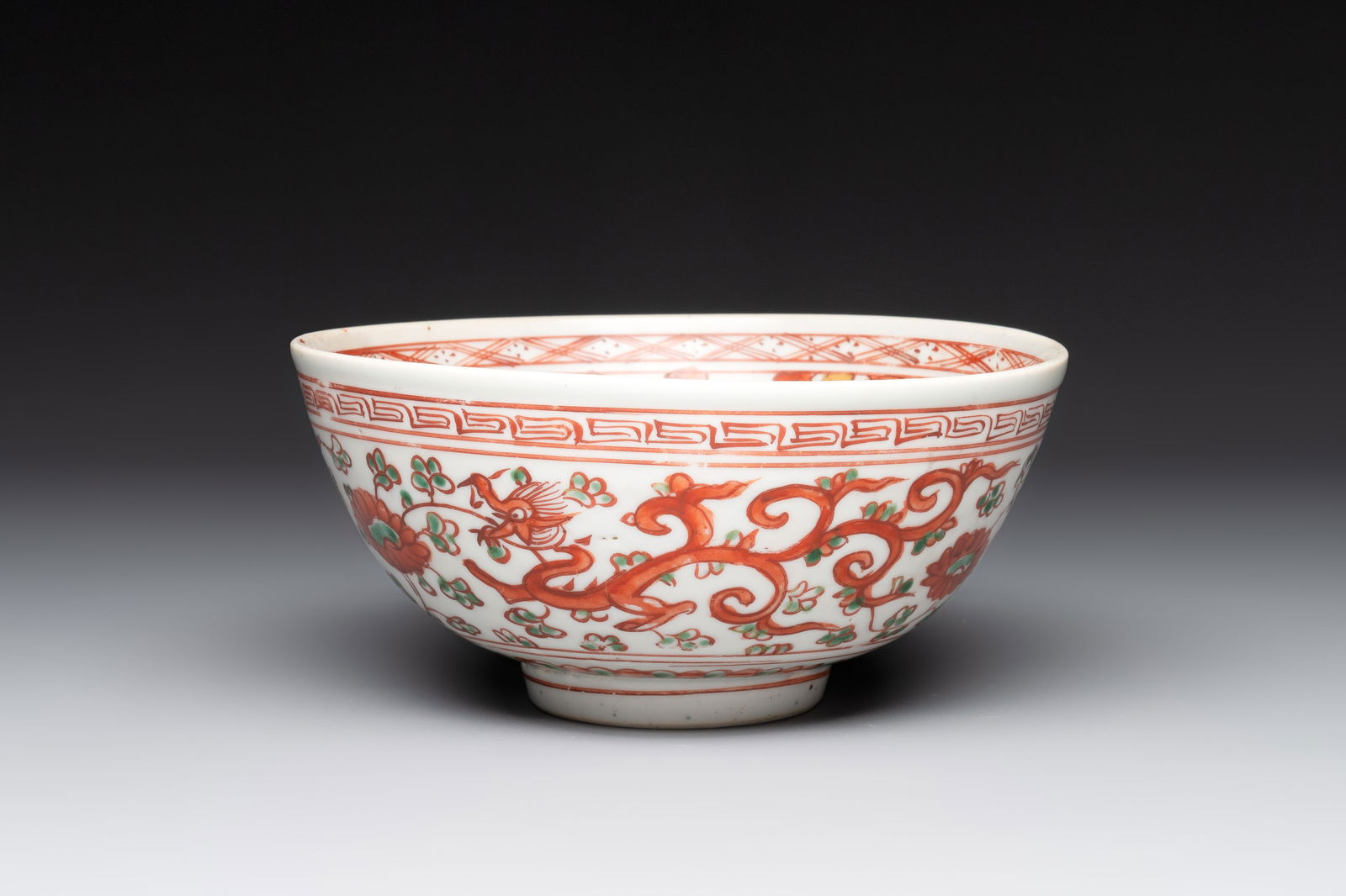 A Chinese wucai 'dragon and phoenix' bowl, Shi 石 mark, Transitional period (1 of 6)