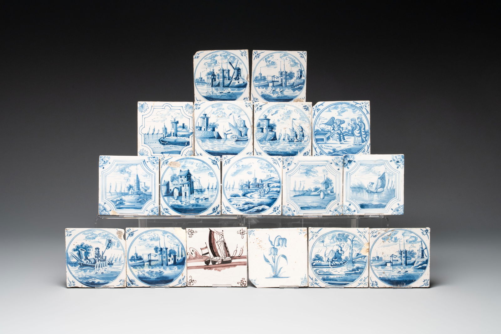 16 blue and white Dutch Delft tiles and one manganese 'ship' tile, 18th C. (1 of 1)