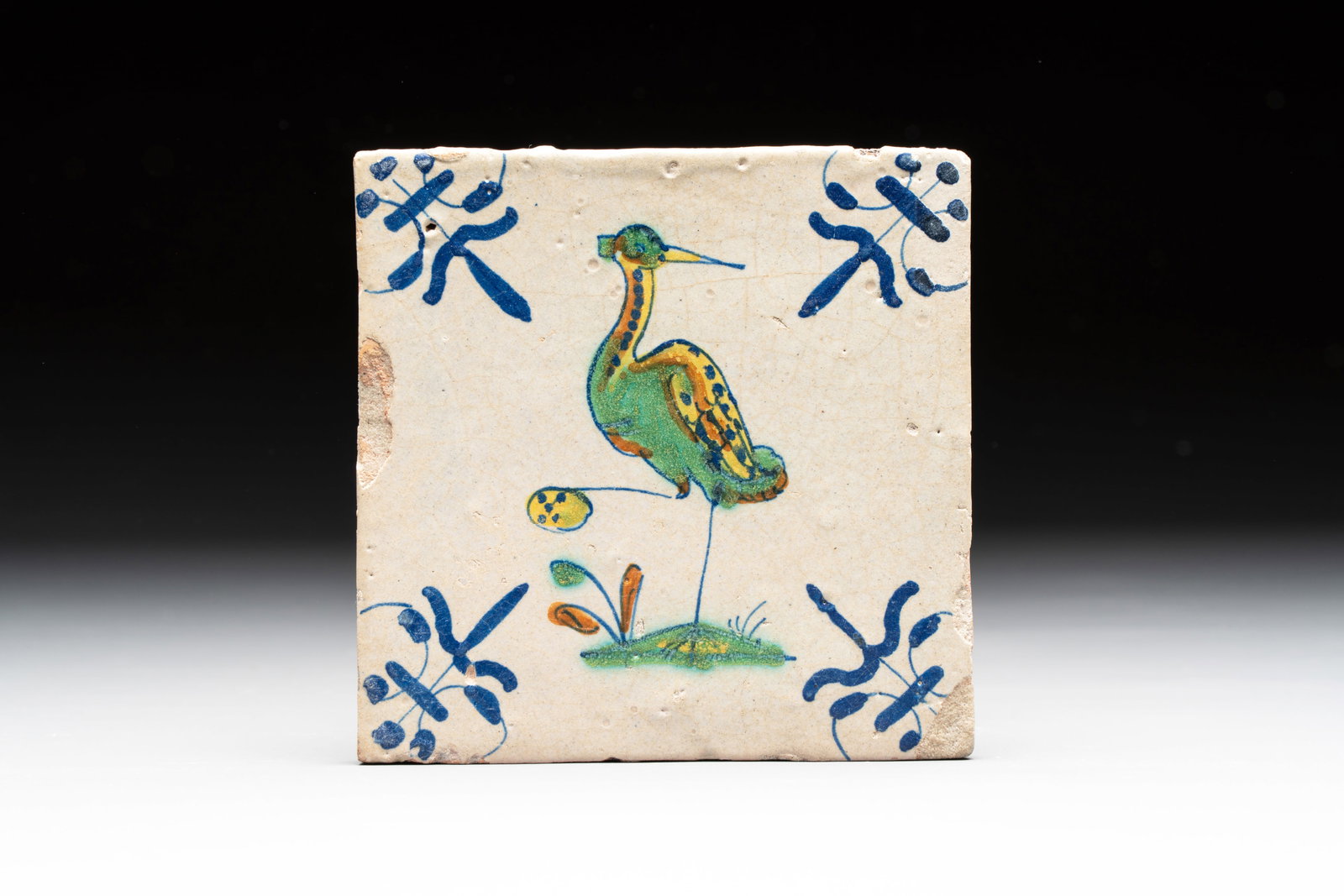 A polychrome Dutch Delft 'heron' tile, 17th C. (1 of 2)