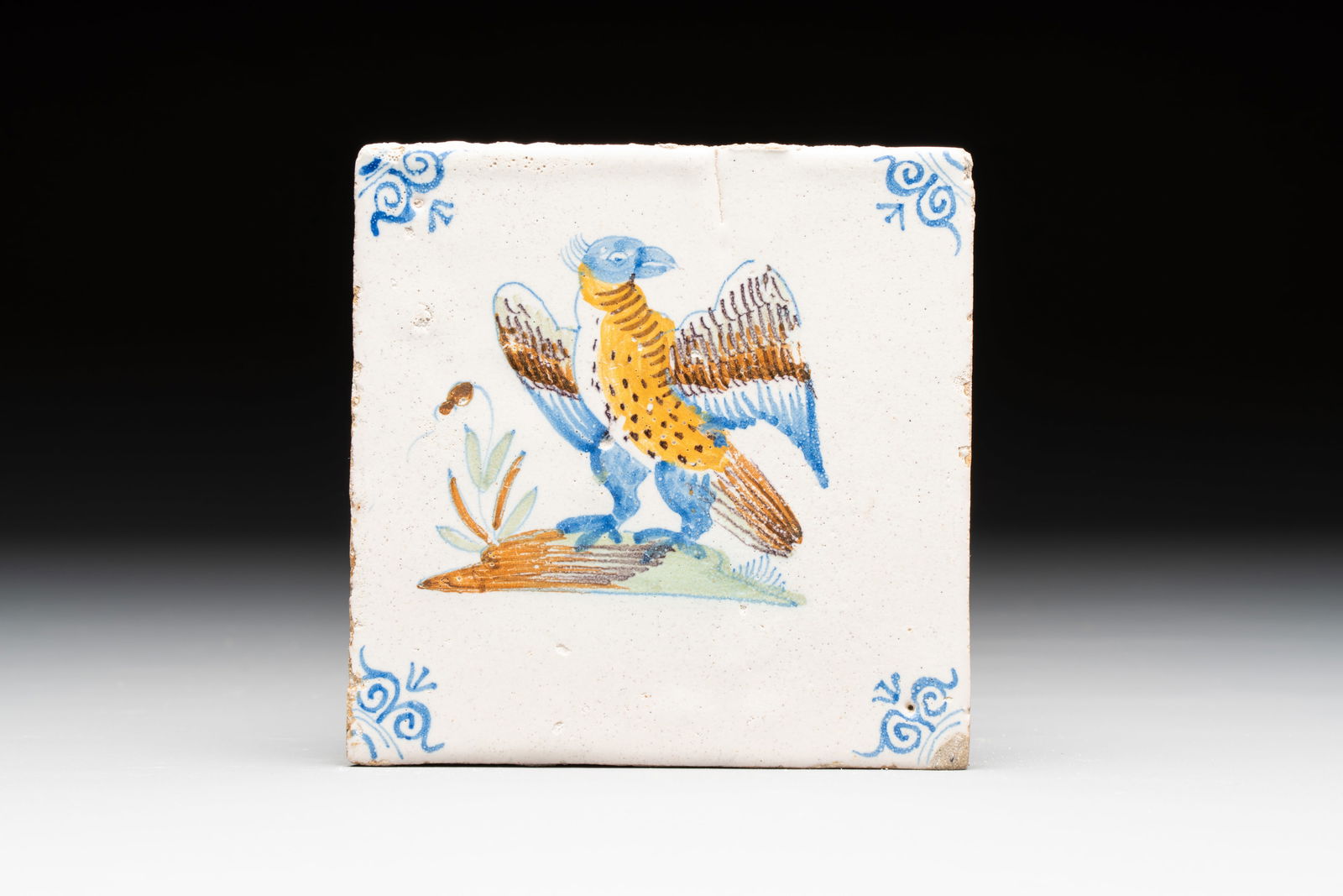 A polychrome Dutch Delft 'bird of prey' tile, 17th C. (1 of 2)