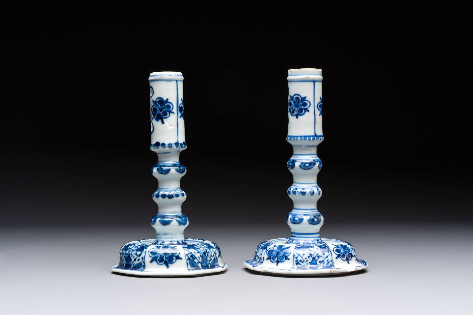 A pair of Chinese blue and white candlesticks with floral design, Kangxi