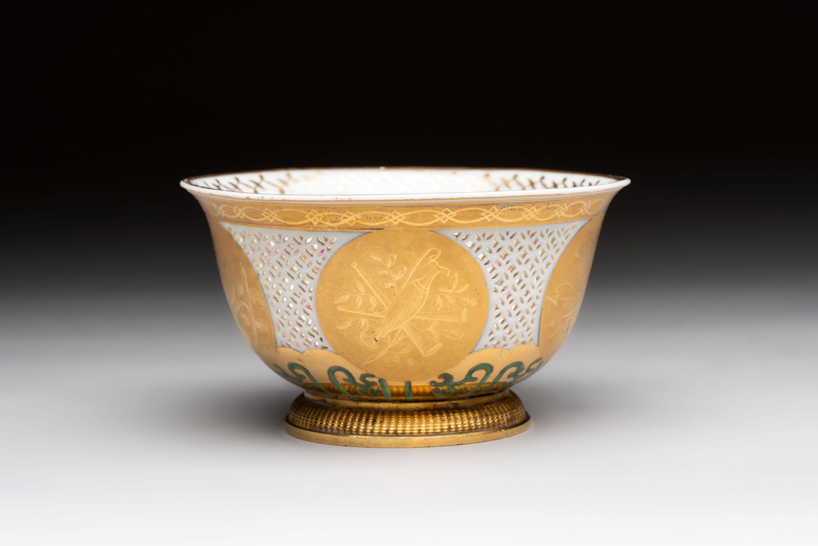 A Chinese European-decorated gilt bronze-mounted blue and white reticulated bowl, Transitional