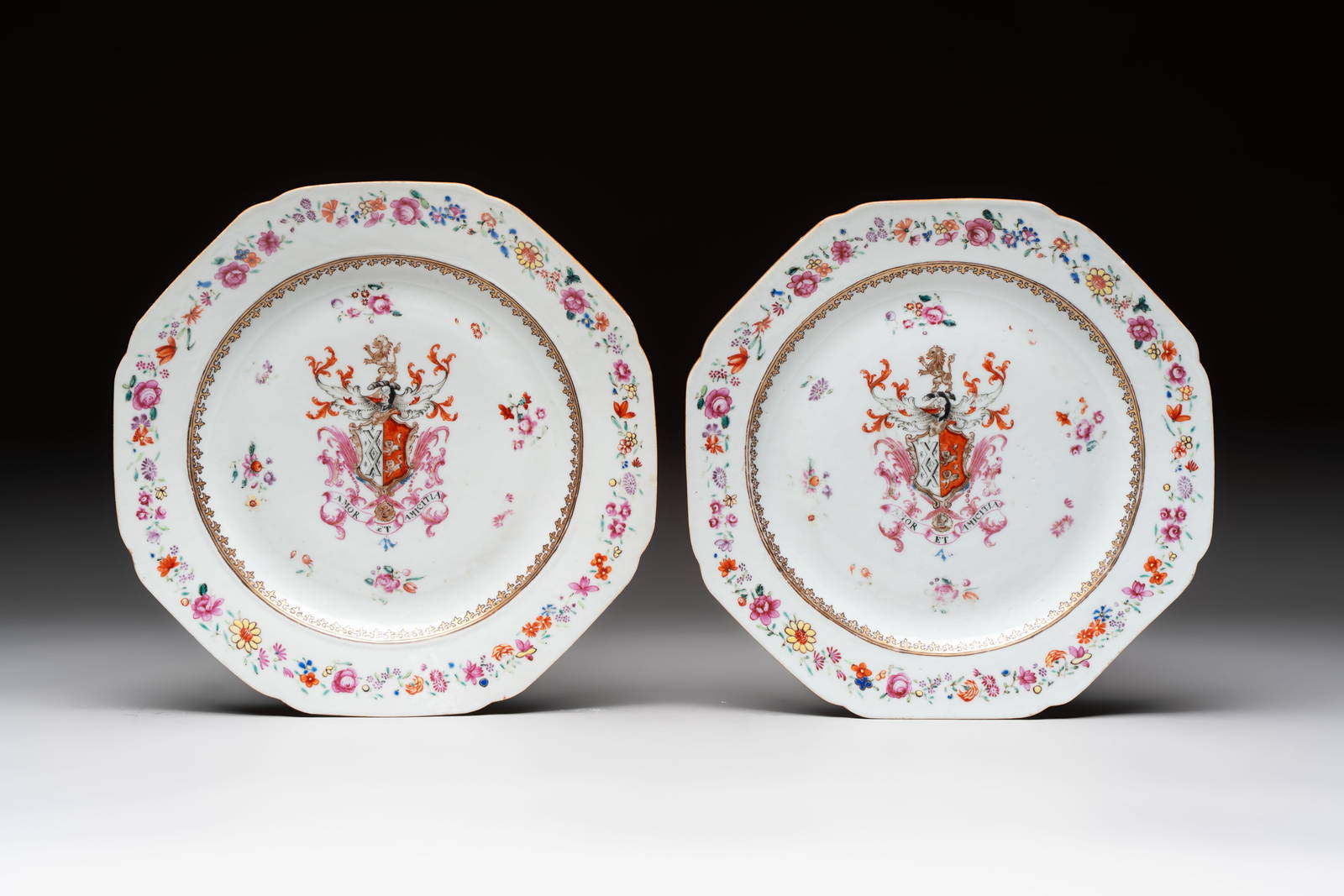 A pair of Chinese famille rose armorial plates with the arms of Mills impaling Hatch for the English