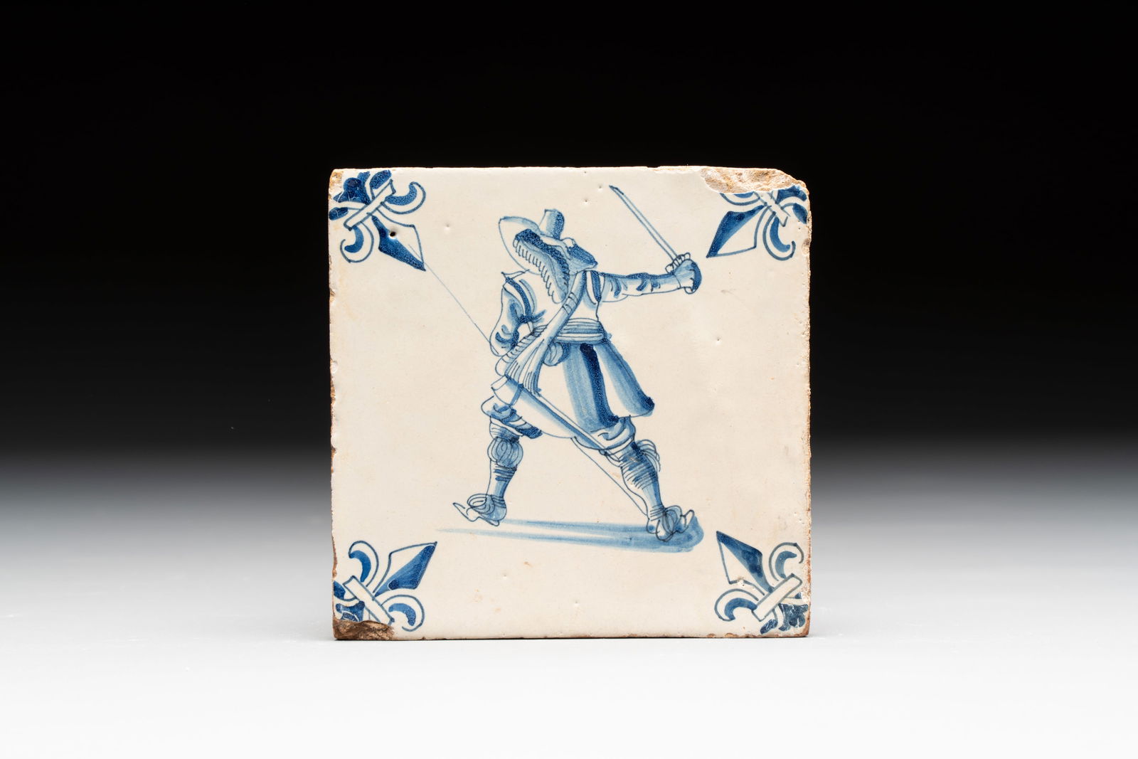 A small blue and white Dutch Delft 'soldier' tile, early 17th C. (1 of 3)