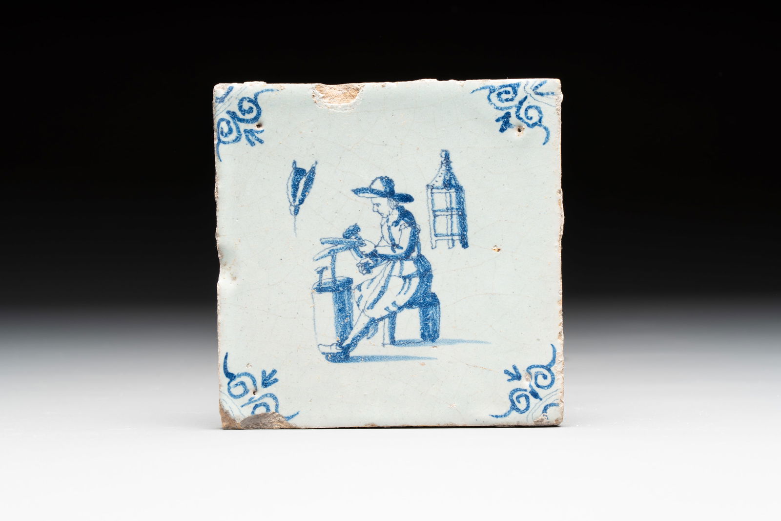 A blue and white Dutch Delft 'coppersmith' tile, 17th C. (1 of 3)