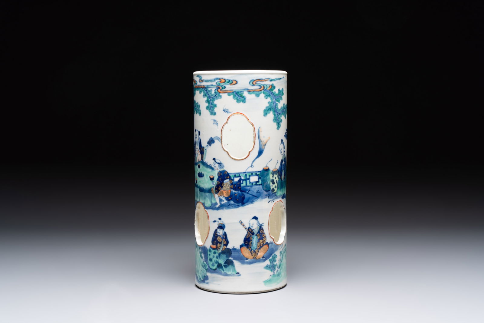 A Chinese doucai gilt-decorated 'Eight Immortals' openworked hat stand, Kangxi mark, 19th C.