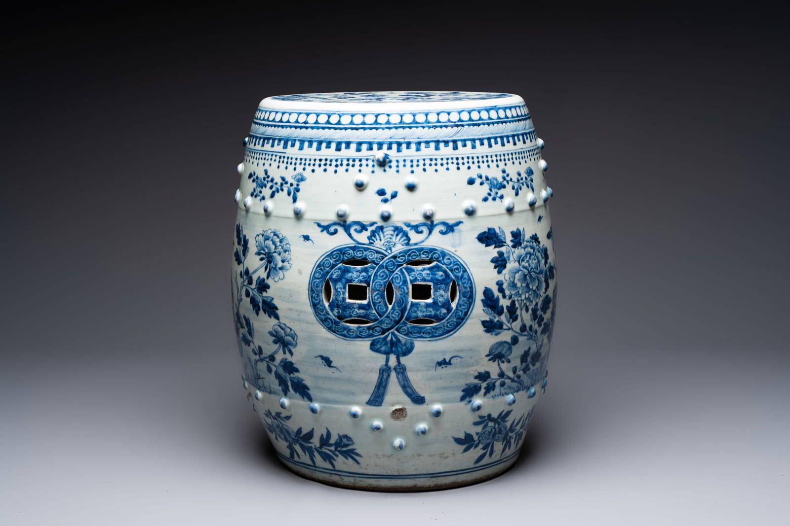 A Chinese blue and white 'birds among flowering branches' garden seat, 19th C.