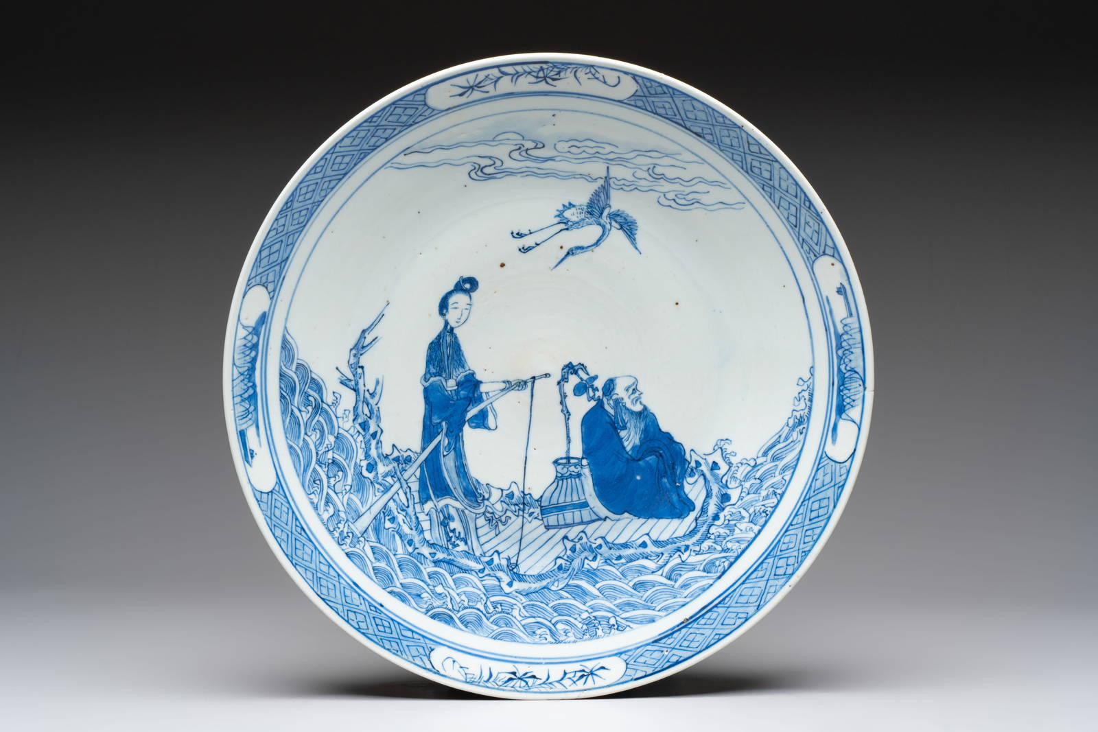 A Chinese blue and white 'Xian Ren Cheng Cha' dish, 19th C.