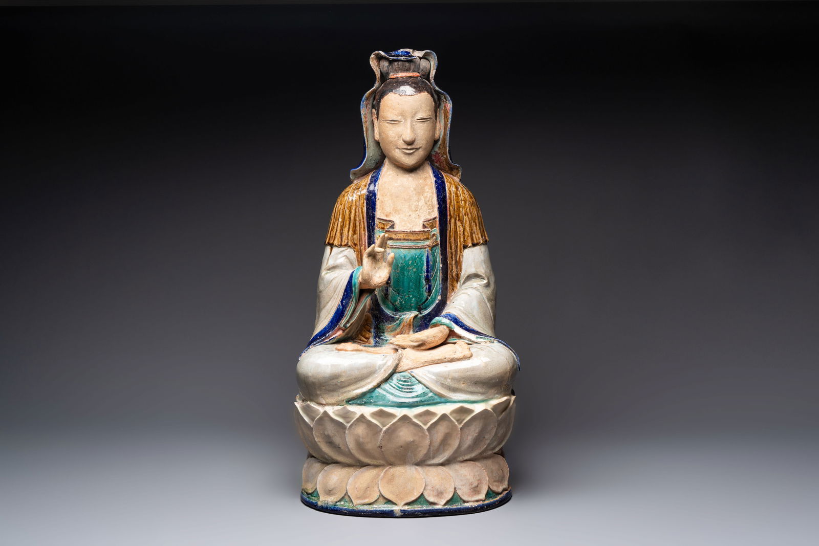 A large Chinese polychrome-glazed Shiwan stoneware figure of Guanyin, 19th C. (1 of 6)