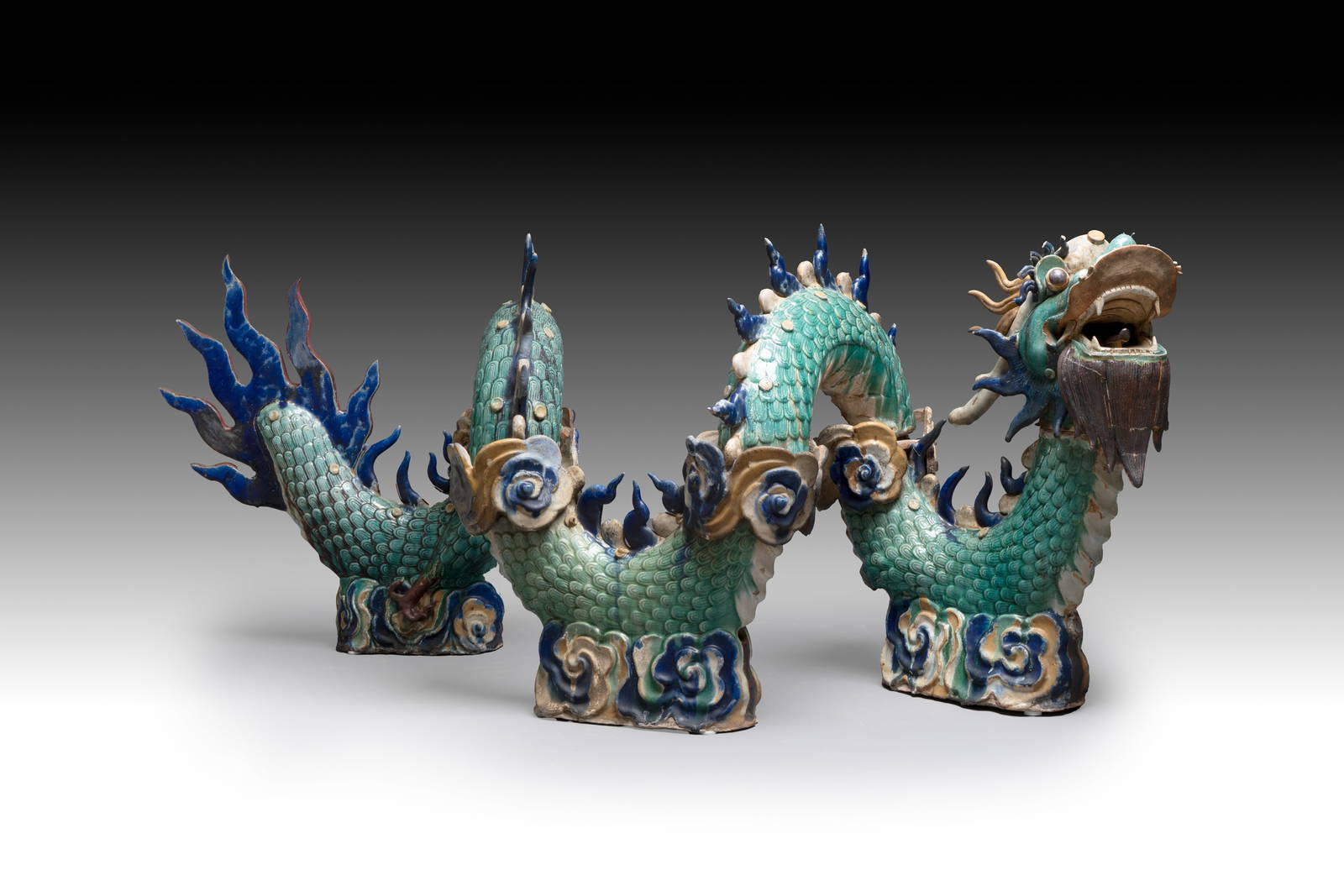A large Chinese polychrome-glazed Shiwan stoneware dragon, 19th C.