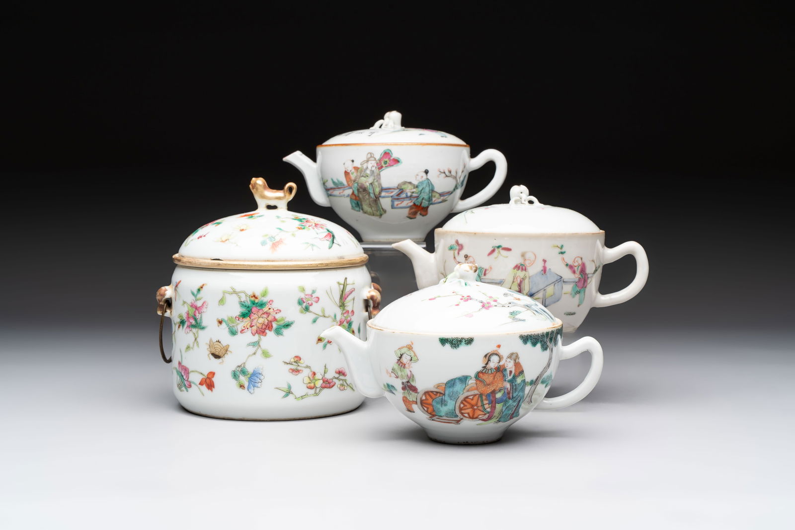 Three Chinese famille rose covered teapots and a warming bowl, Tongzhi, Guangxu and Lu Zhi Xiang Zhi: Three Chinese famille rose covered teapots and a warming bowl, Tongzhi, Guangxu and Lu Zhi Xiang Zhi marks, 19th C. L.: 14 cm - H.: 14,4 cm (the warming bowl incl. cover) L.: 16 cm - H.: 9,8 cm (the l