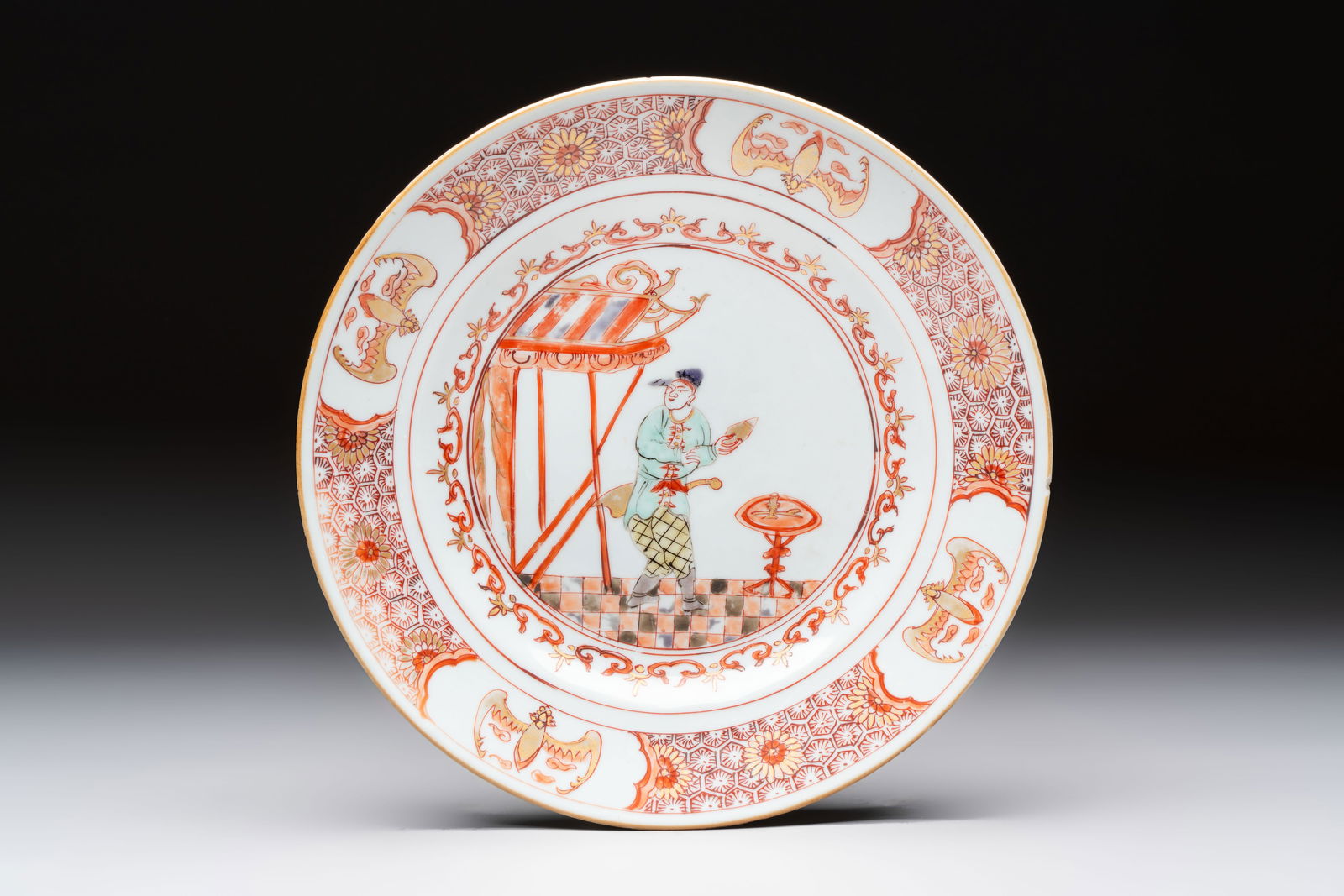 A rare Chinese polychrome 'Commedia dell'arte' 'South Sea Bubble' plate, Yongzheng, ca. 1720-1725 (1 of 2)