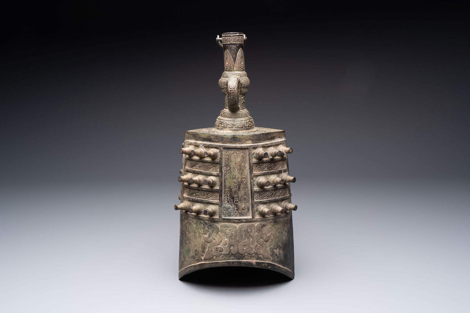 A large Chinese archaistic inscribed bronze bell, 'Zhong', Ming (1 of 6)