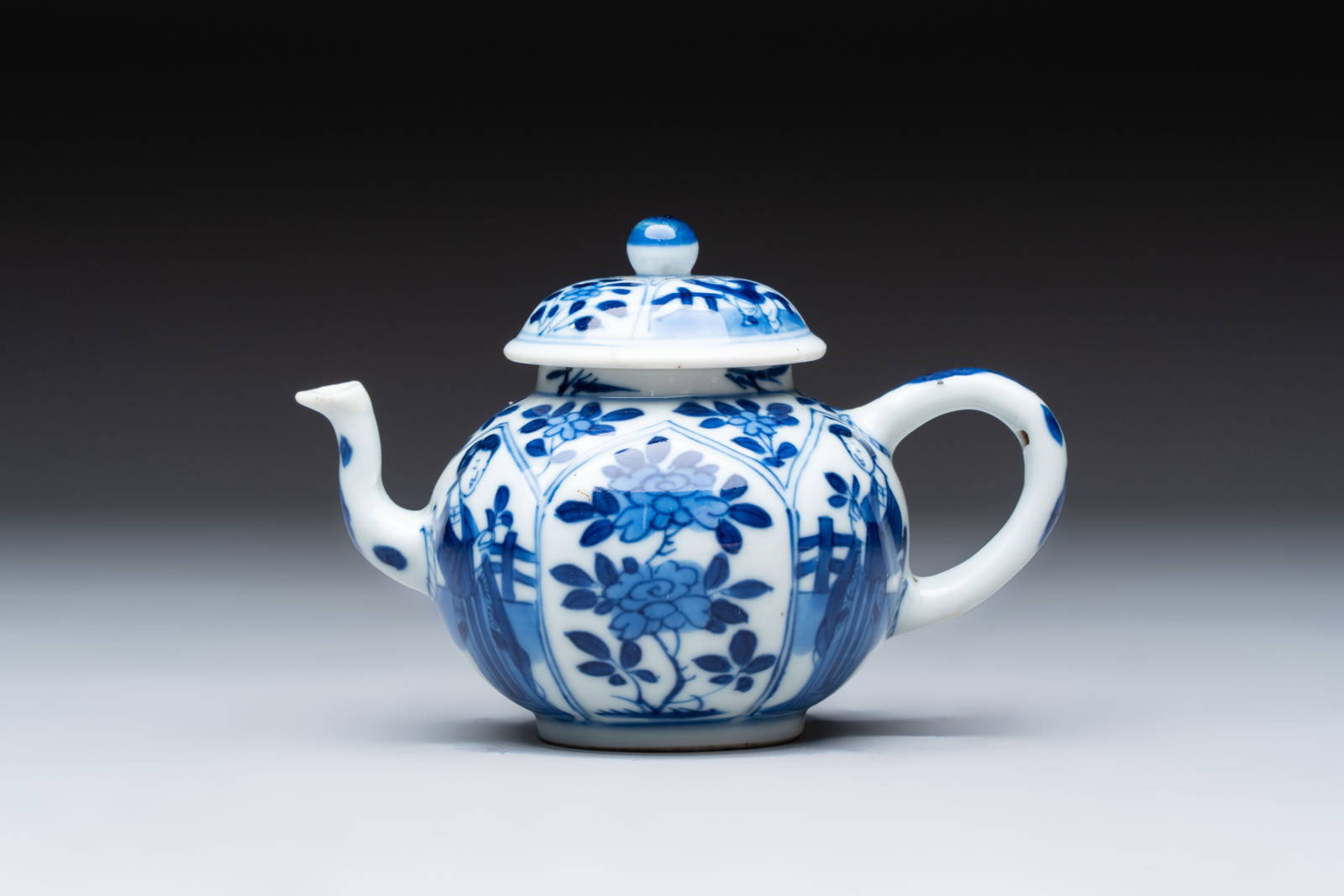 A small Chinese blue and white 'Long Eliza' teapot and cover, jade mark, Kangxi
