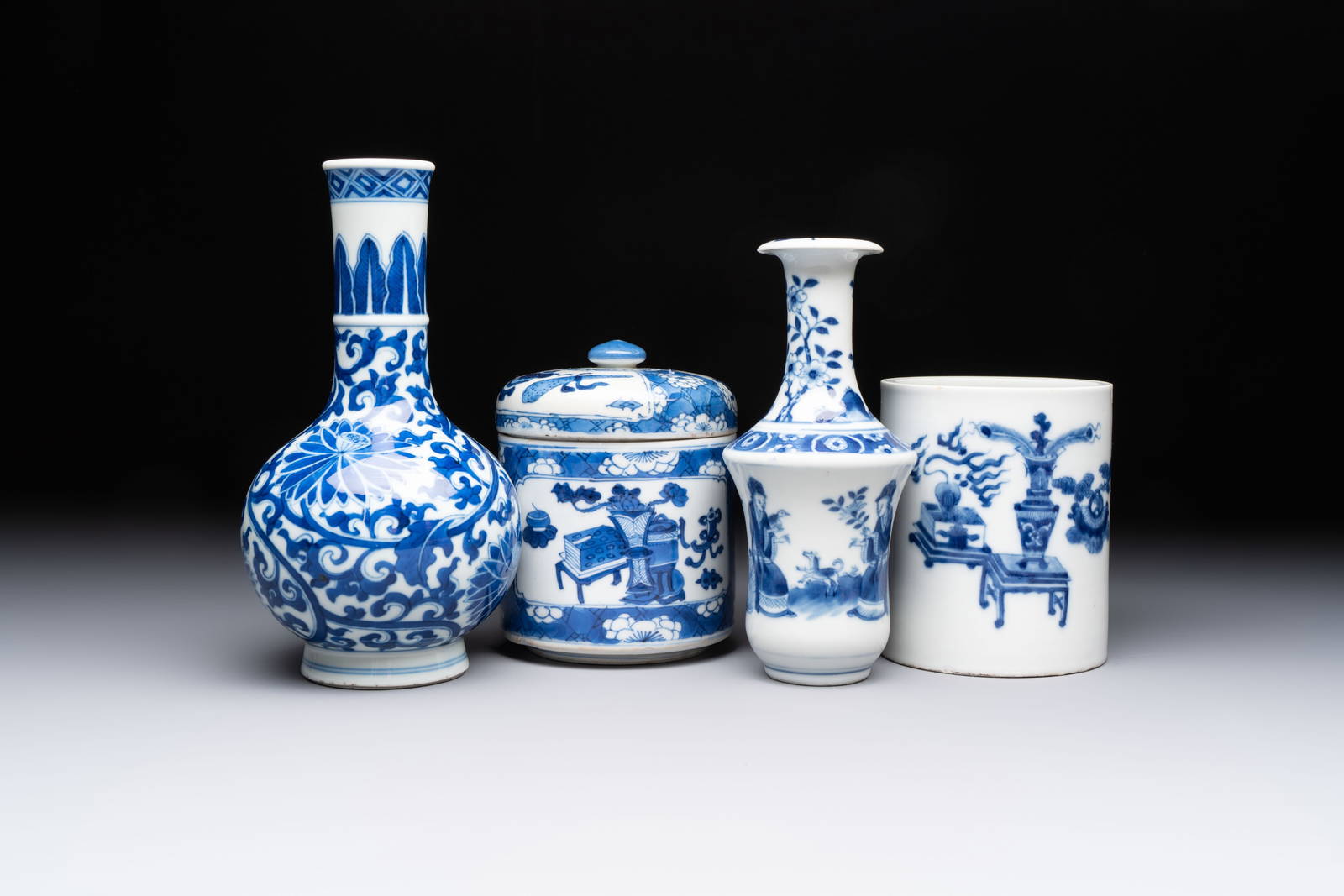 Two Chinese blue and white vases, a covered jar and a brush pot, Kangxi and later