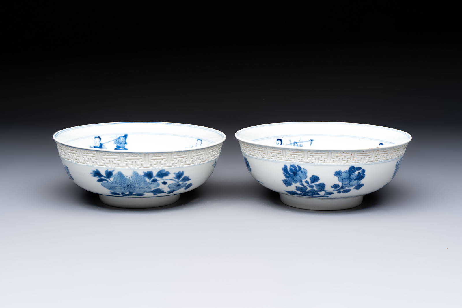 A pair of Chinese blue and white relief-border 'Lan Caihe' bowls, Kangxi