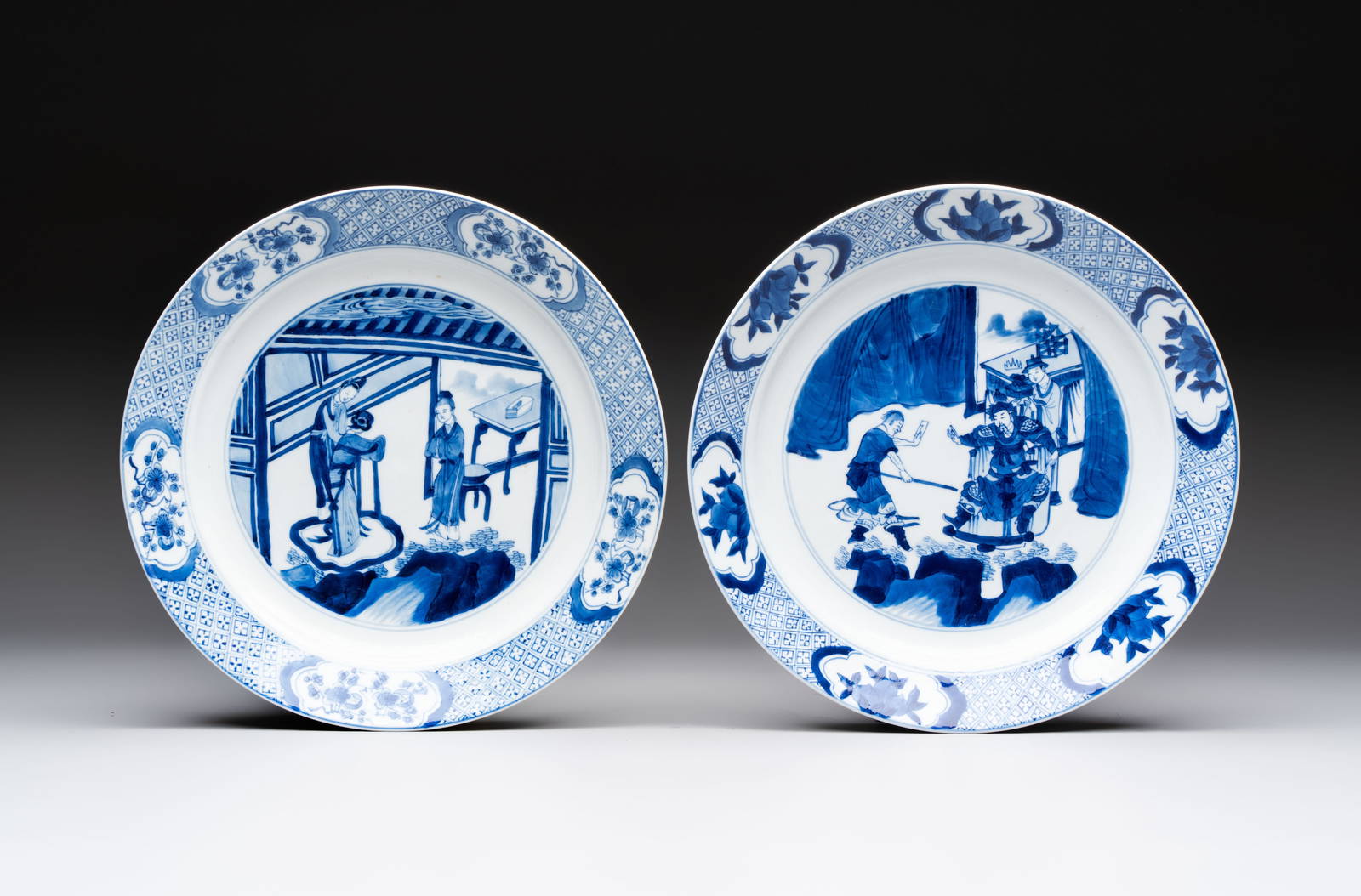 Two Chinese blue and white plates with figural design, Kangxi marks and of the period