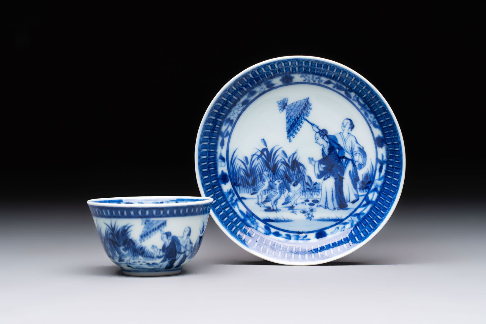 A rare Chinese blue and white 'Dames au Parasol' cup and saucer after Cornelis Pronk, Qianlong, ca. (1 of 10)