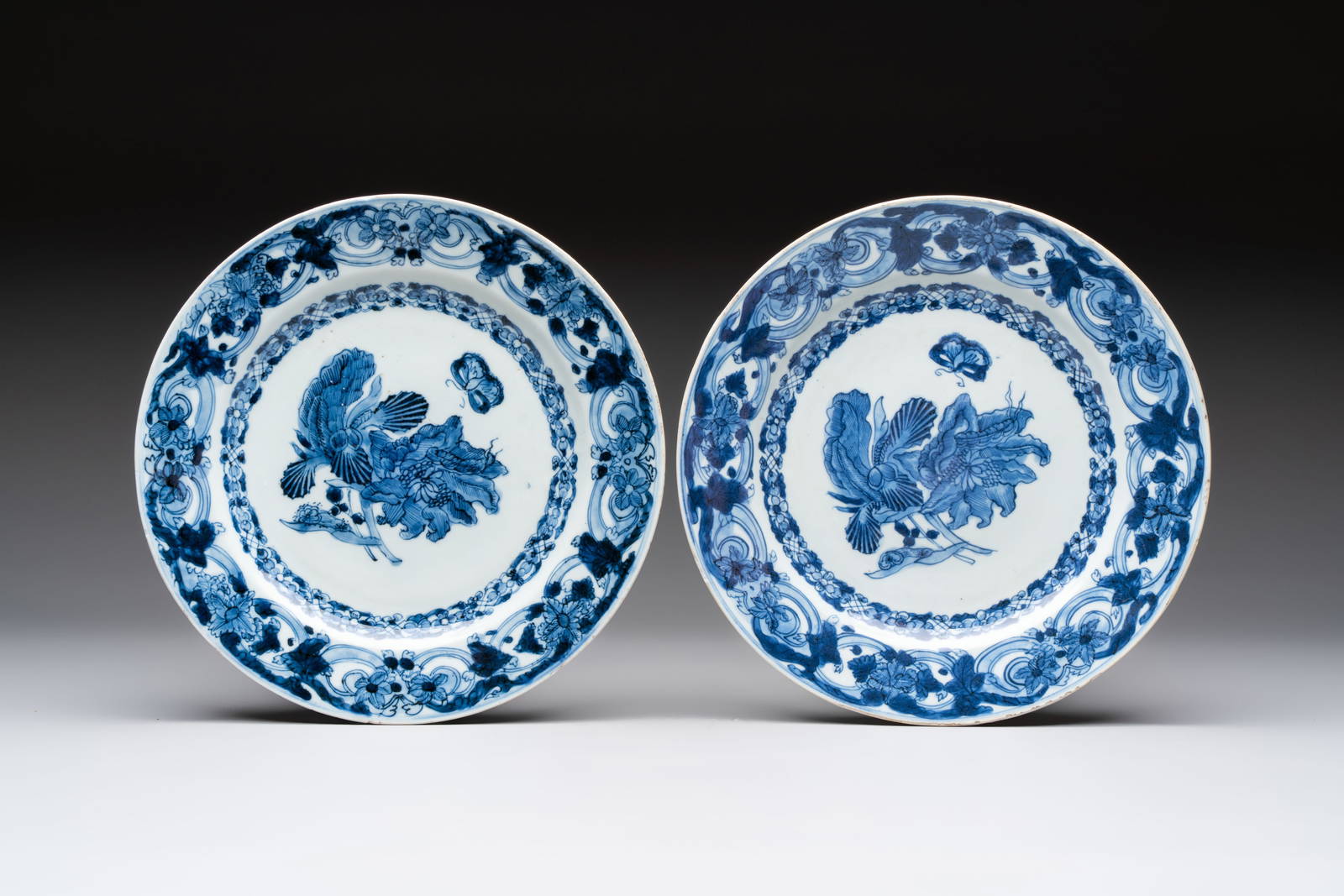 A pair of Chinese blue and white 'botanical' dishes after Maria Sybilla Merian, Qianlong
