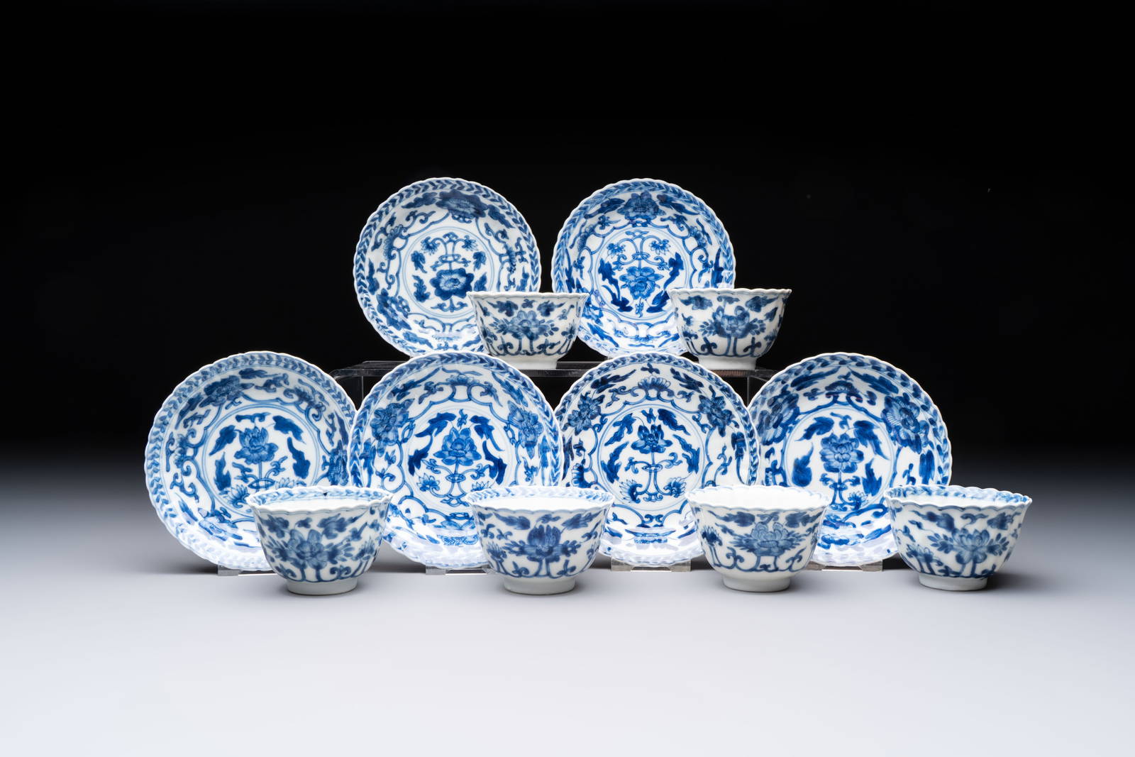 A set of six Chinese blue and white cups and saucers with floral design, Kangxi