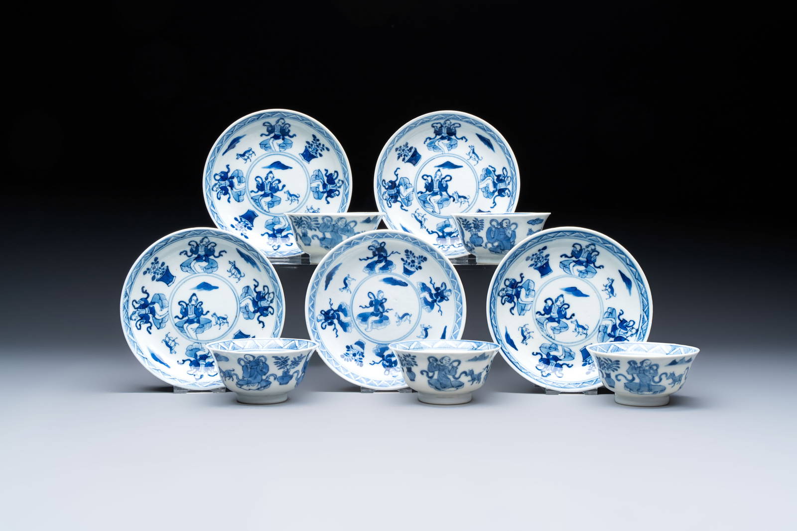Five Chinese blue and white cups and saucers, Kangxi mark, 19th C.