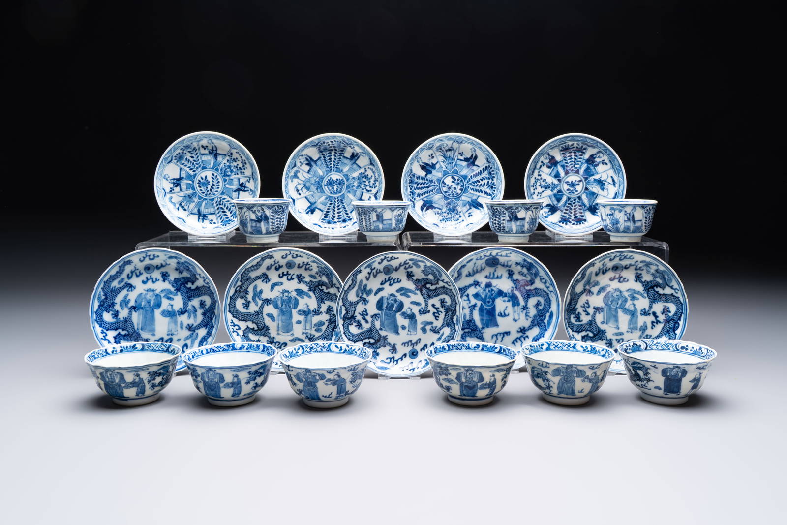 Ten Chinese blue and white cups and nine saucers, Kangxi mark, 19th C.
