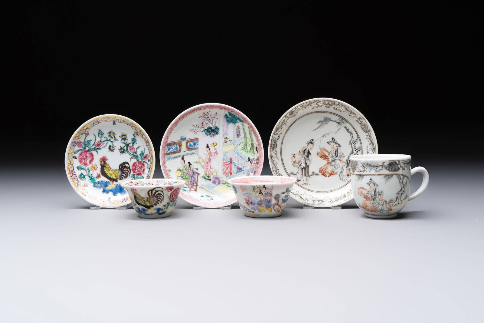 Three Chinese famille rose and grisaille cups and saucers, Qianlong