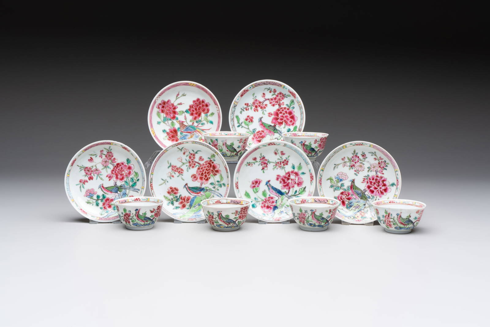 A set of six Chinese famille rose 'peacock' cups and saucers, Yongzheng