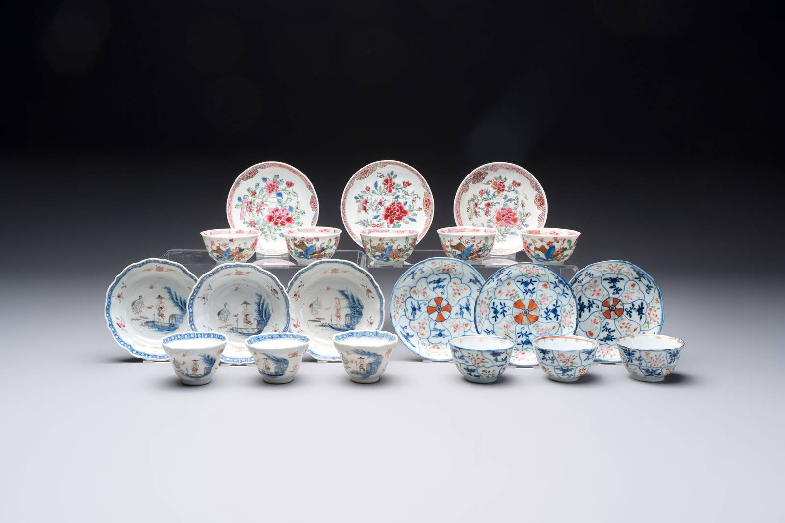 Eleven Chinese famille rose cups and nine saucers, Yongzheng/Qianlong