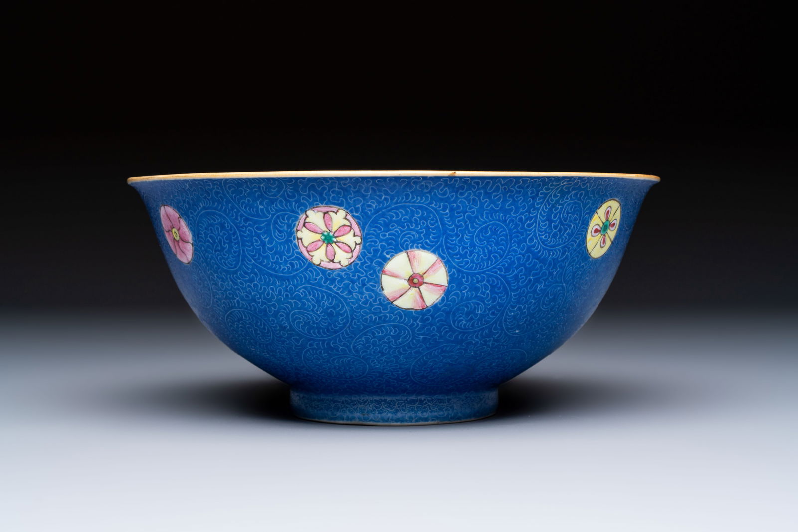 A Chinese famille rose blue-ground sgraffito bowl, Qianlong mark and of the period (1 of 6)