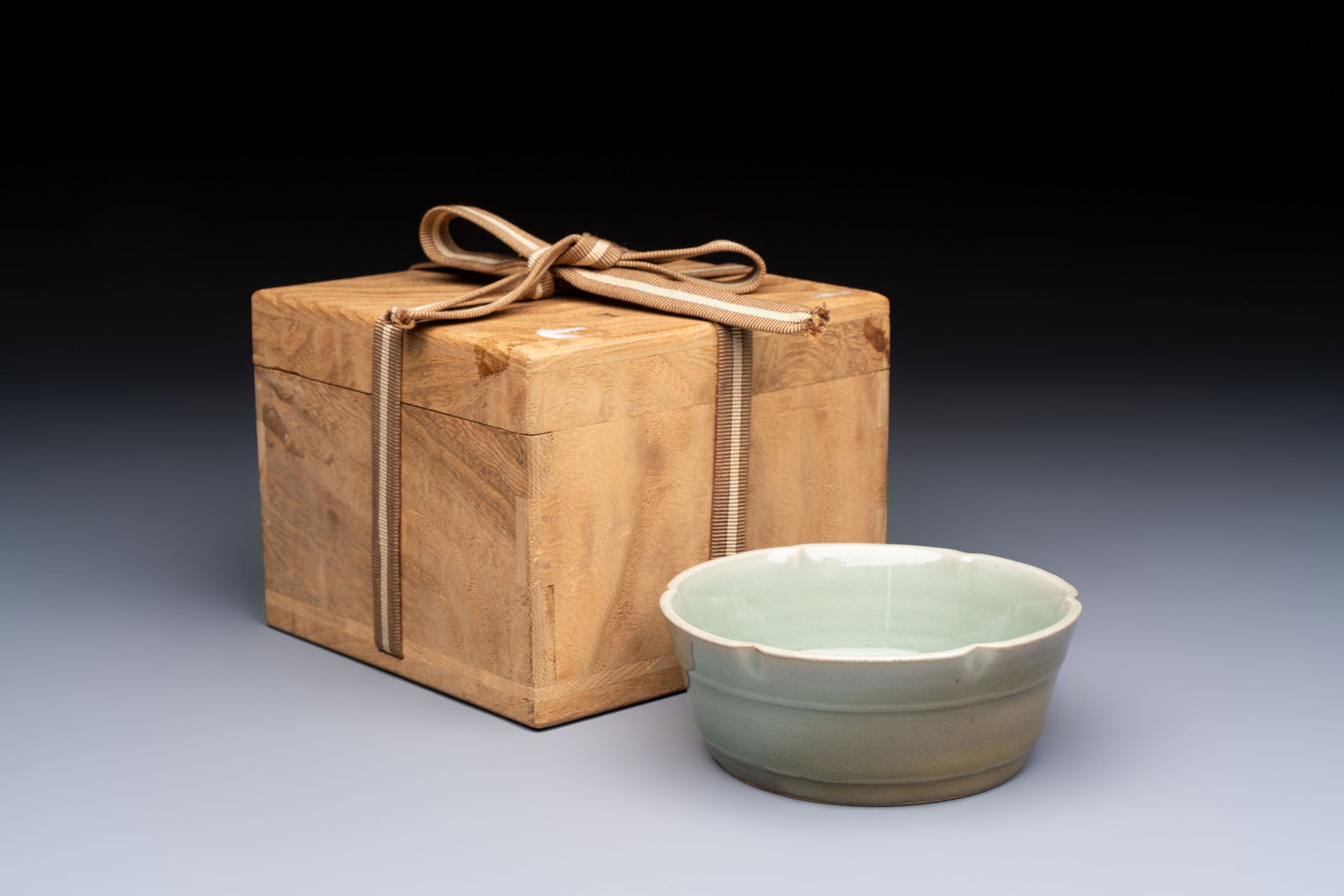 A Chinese Longquan celadon flower-shaped brush washer with a wooden box, Southern Song (1 of 7)