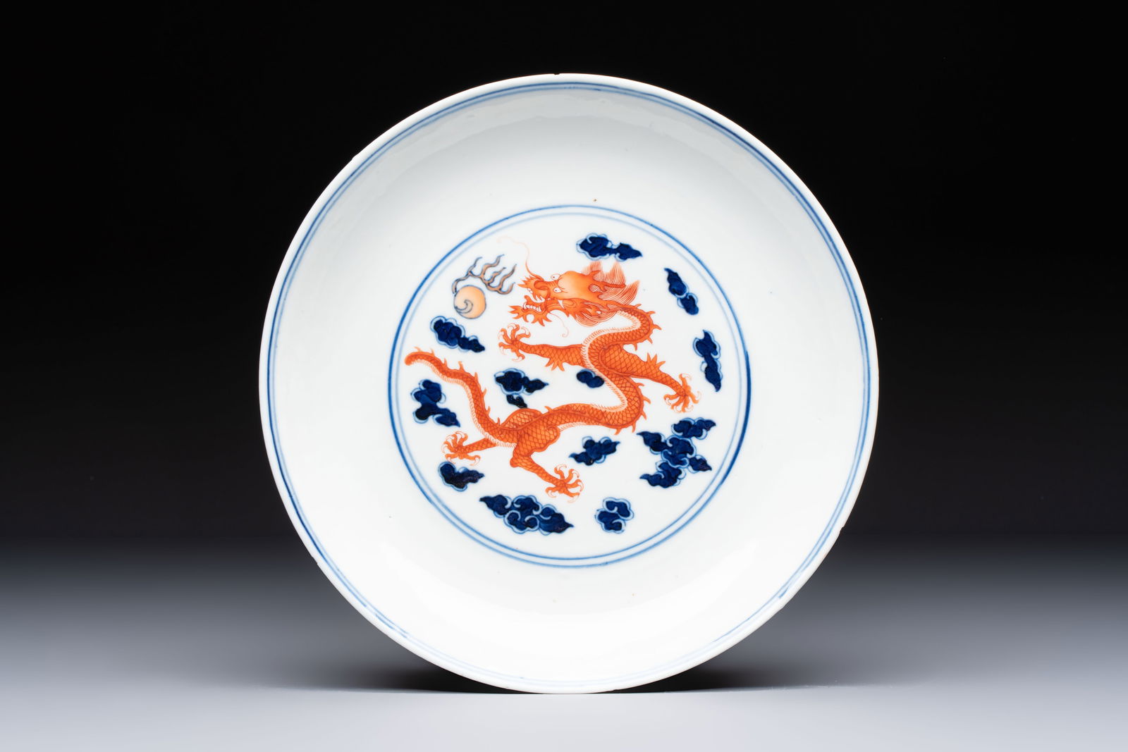 A Chinese blue and white iron-red-decorated 'Dragon' plate, Jing Jin Tang mark, 19th C.: A Chinese blue and white iron-red-decorated 'Dragon' plate, Jing Jin Tang mark, 19th C. Dia.: 23,5 cm