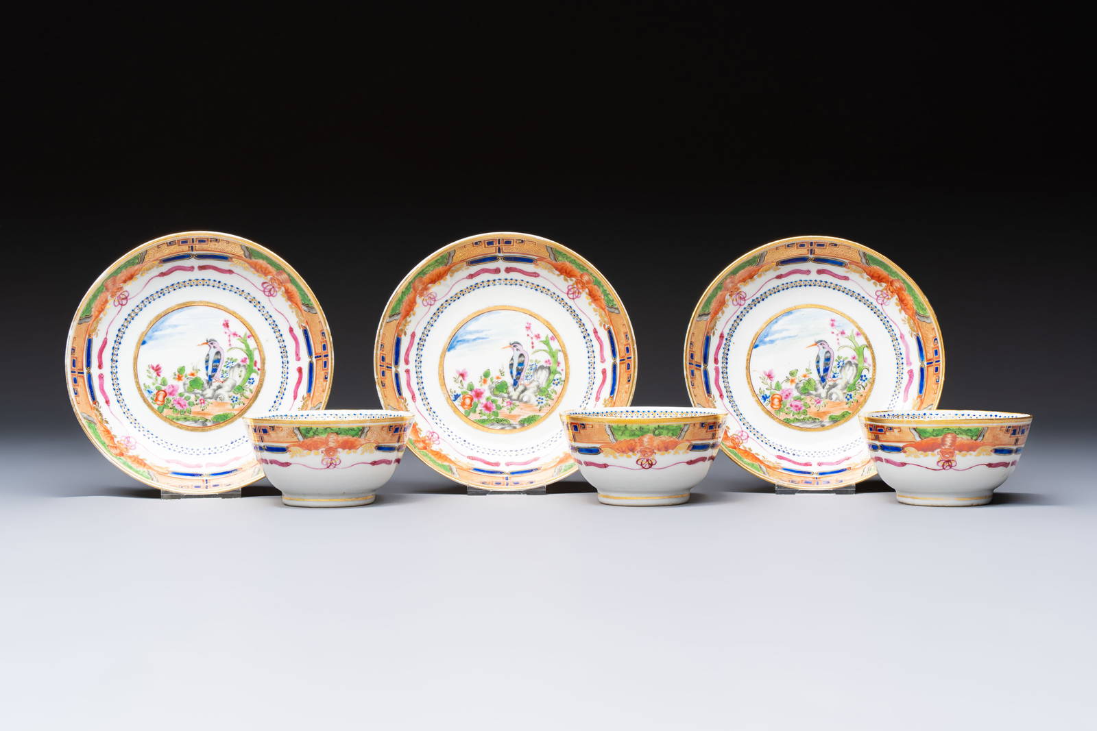 Three sets of Chinese famille rose gilt-decorated 'Bird among Flowering Branches' cups and saucers,